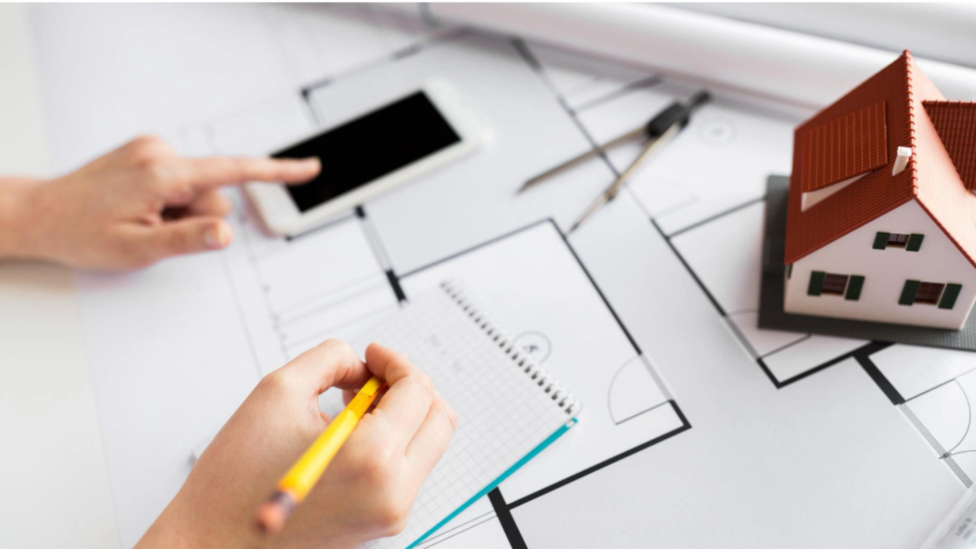 ADU floor plan design with tablet and notebook planning in Los Angeles by Your ADU Guy