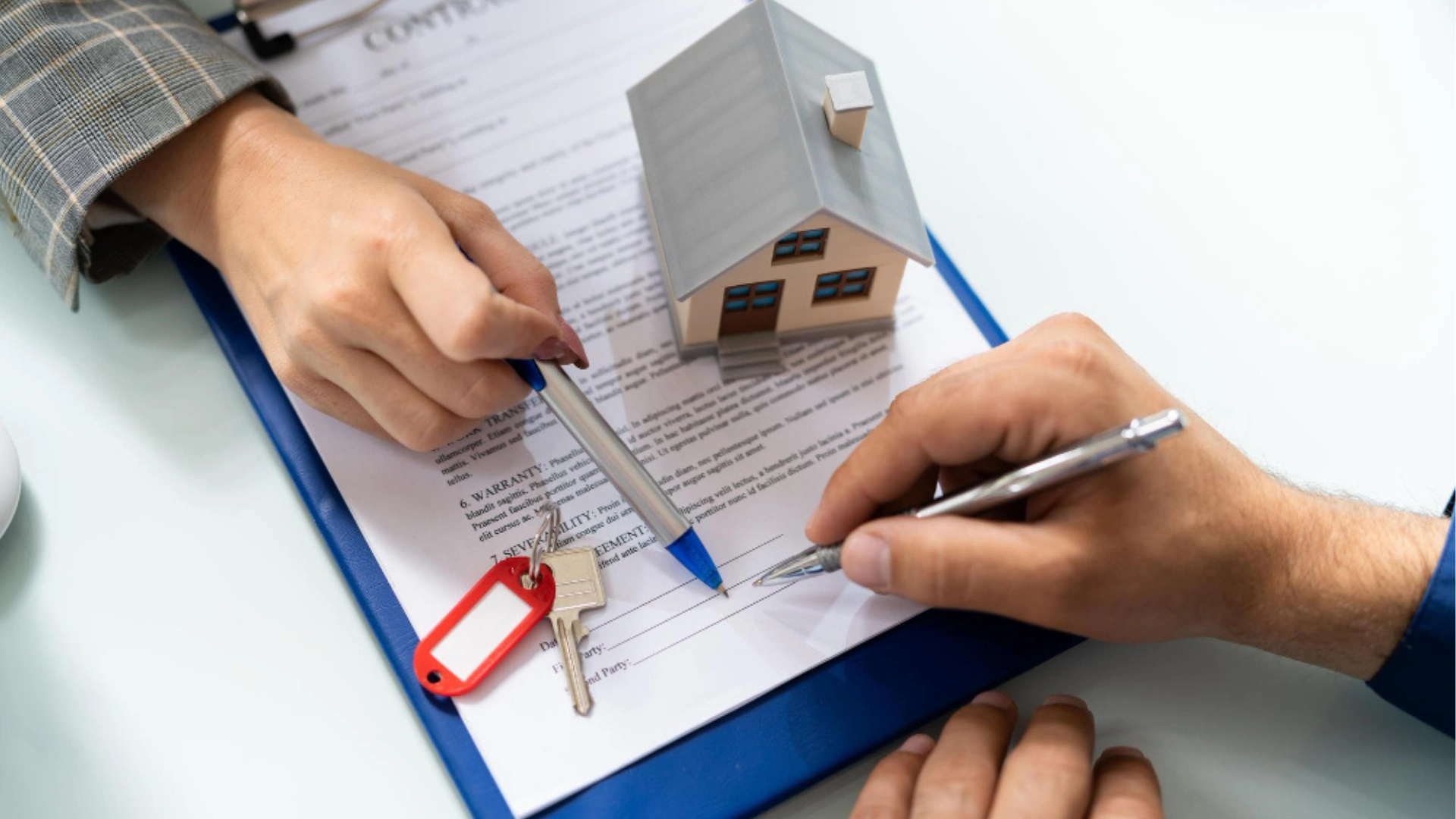 signing property documents for ADU permits and planning in Los Angeles by Your ADU Guy